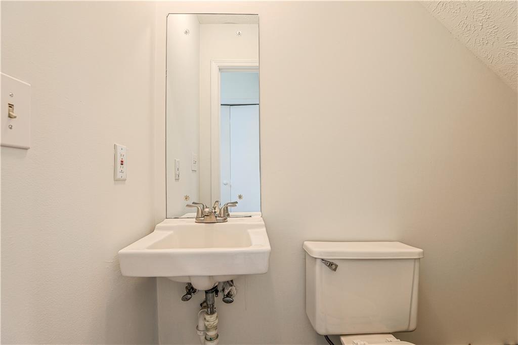 732 South Candler Street Decatur, GA 30030 - Photo 10 of 29 a bathroom with a sink a toilet and mirror