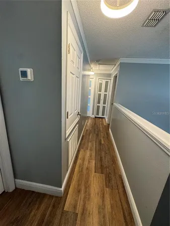 a view of balcony with wooden floor
