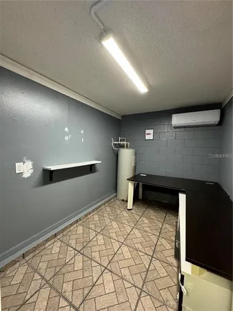 a view of a livingroom with an empty space and a window