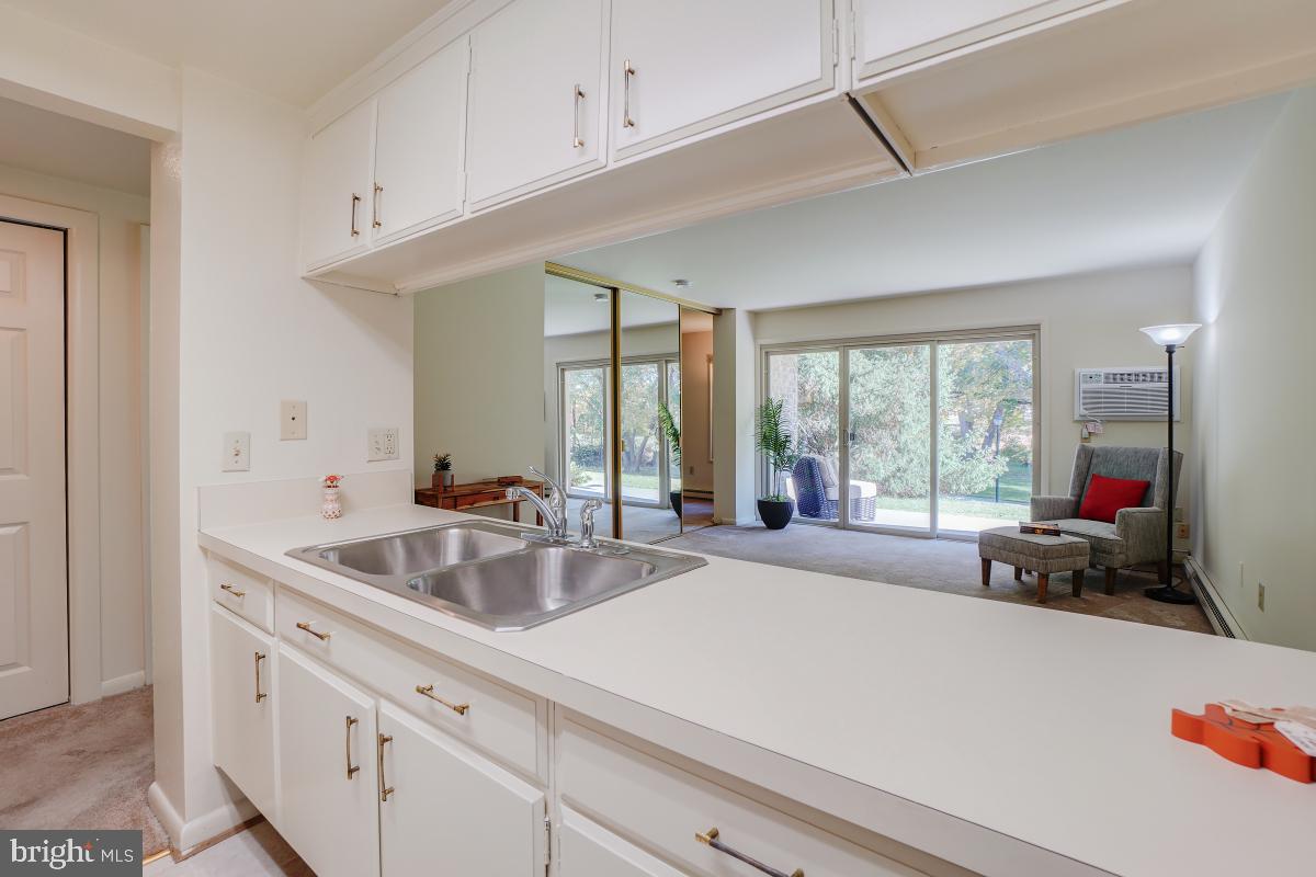 3314 Chiswick Court, Unit 621G Silver Spring, MD 20906 - Photo 3 of 10 a kitchen with a sink and large window