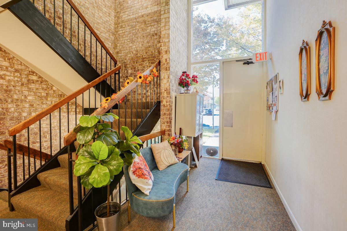 3314 Chiswick Court, Unit 621G Silver Spring, MD 20906 - Photo 4 of 19 Inviting entryway with resident artwork