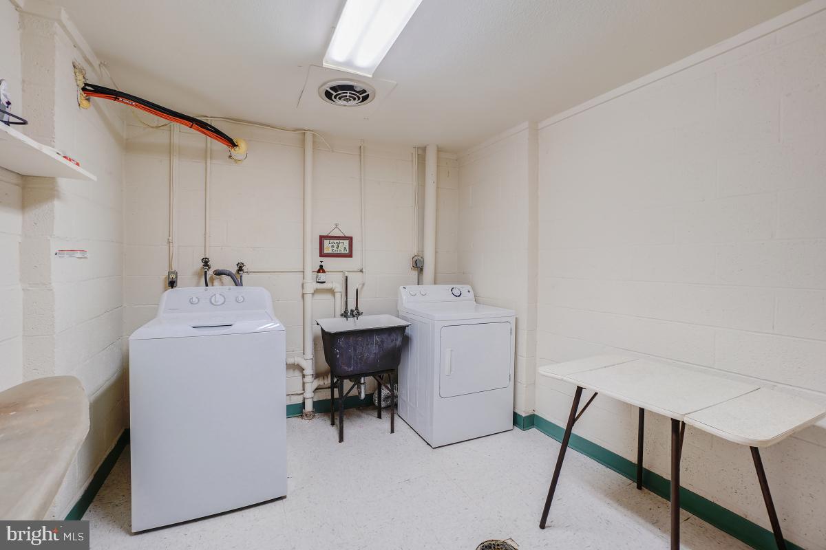 3314 Chiswick Court, Unit 621G Silver Spring, MD 20906 - Photo 10 of 10 a room with a table chairs and a workspace