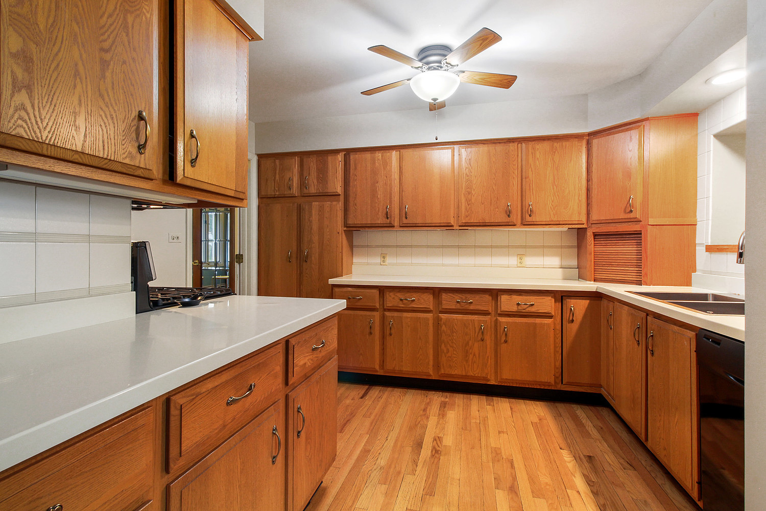 27W466 Manchester Road Winfield, IL 60190 - Photo 8 of 18 a kitchen with a sink cabinets and window