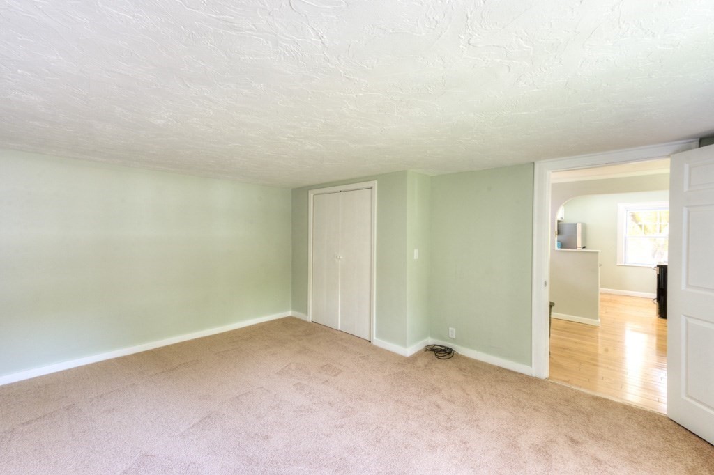 197 Eastern Avenue Worcester, MA 01605 - Photo 20 of 42 an empty room with entrance door