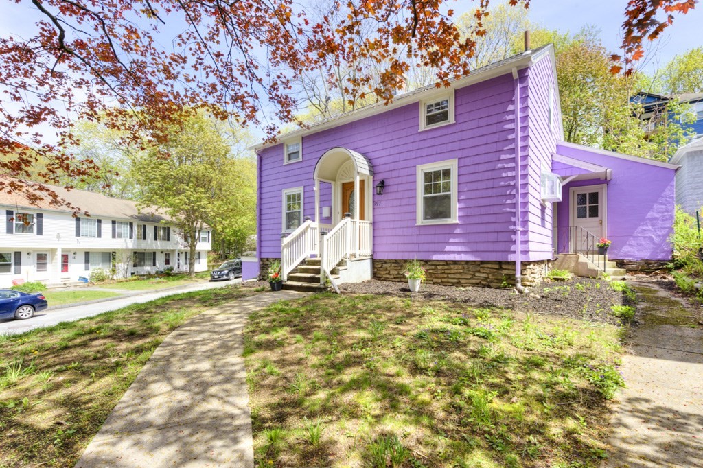 197 Eastern Avenue Worcester, MA 01605 - Photo 2 of 42 a front view of a house with a yard