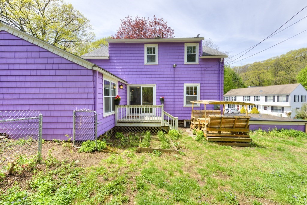 197 Eastern Avenue Worcester, MA 01605 - Photo 40 of 42 a front view of a house with a garden