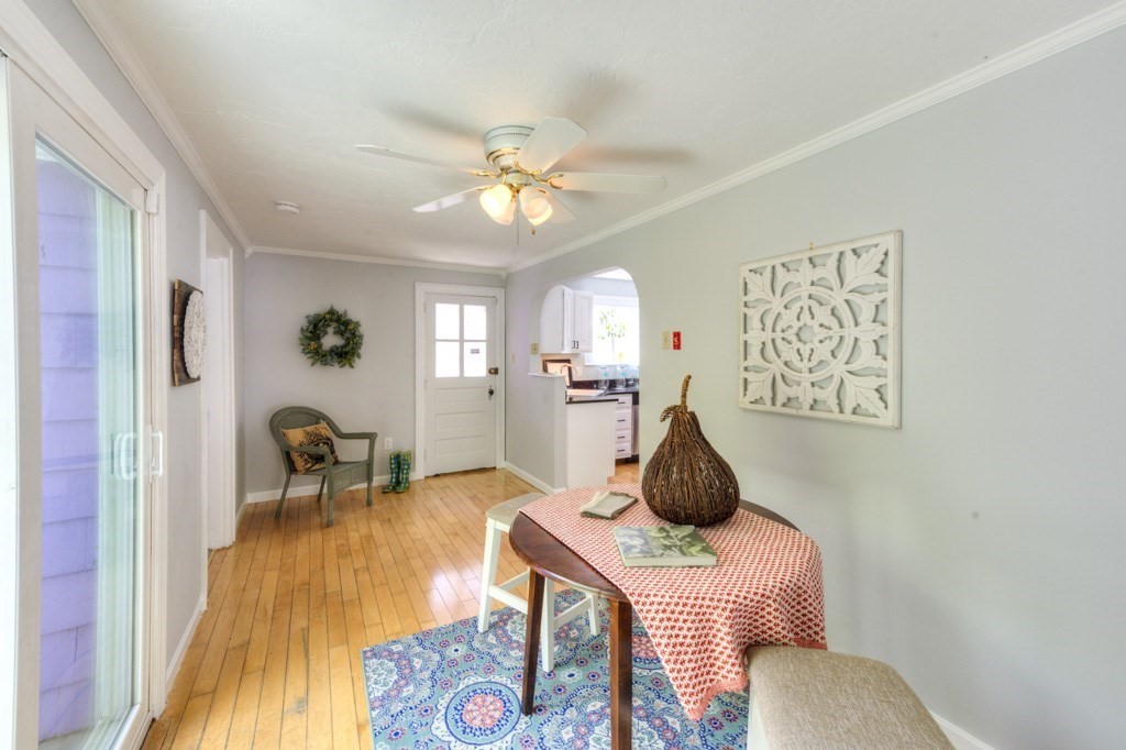 197 Eastern Avenue Worcester, MA 01605 - Photo 7 of 42 a bedroom with a bed and wooden floor