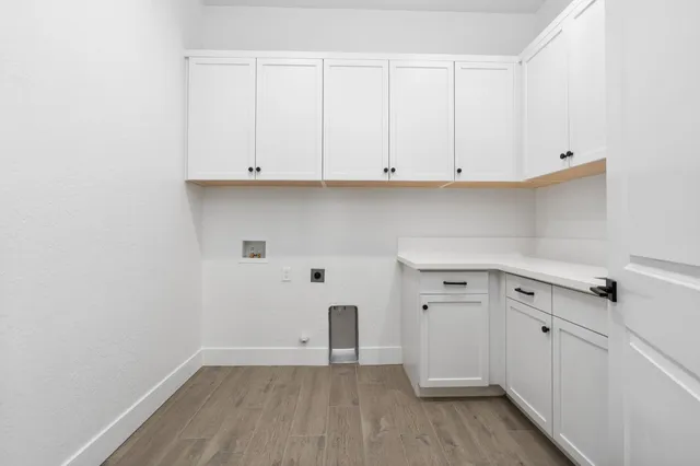 an empty room with a white cabinet door