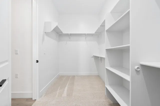 wooden floor with white walls