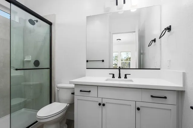 a bathroom with a tub and shower