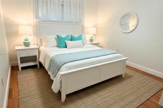 a bedroom with bed and a window