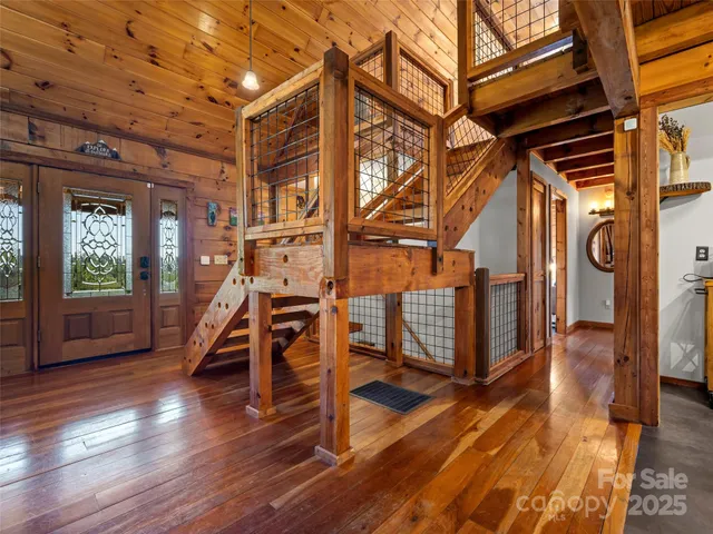 a view of an entryway with wooden floor