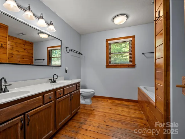 a bathroom with a bathtub and shower
