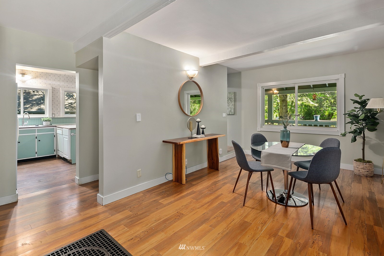 18416 Southeast Petrovitsky Road Renton, WA 98058 - Photo 14 of 36 a view of a dining room with furniture window and wooden floor