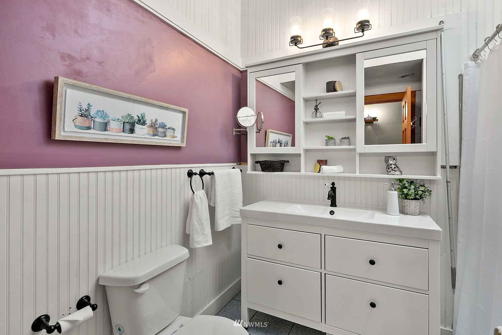18416 Southeast Petrovitsky Road Renton, WA 98058 - Photo 22 of 36 a bathroom with a sink mirror vanity and toilet