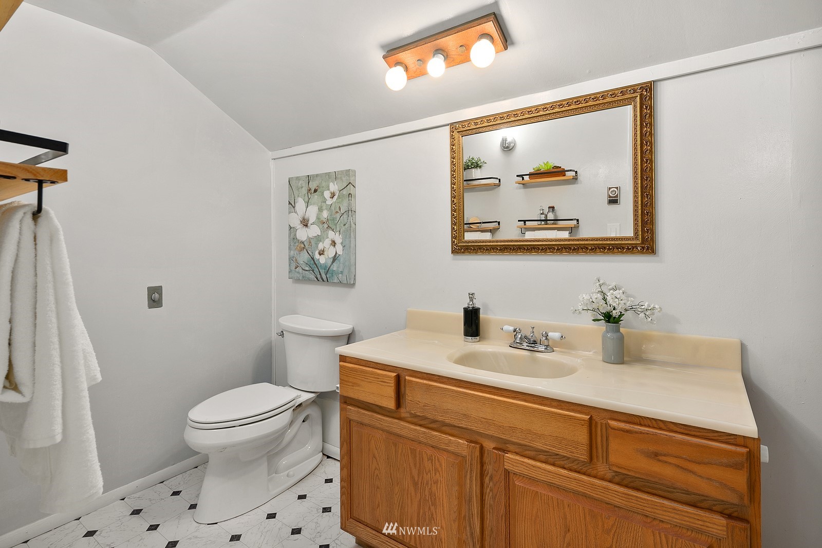 18416 Southeast Petrovitsky Road Renton, WA 98058 - Photo 26 of 36 a bathroom with a sink mirror vanity and toilet
