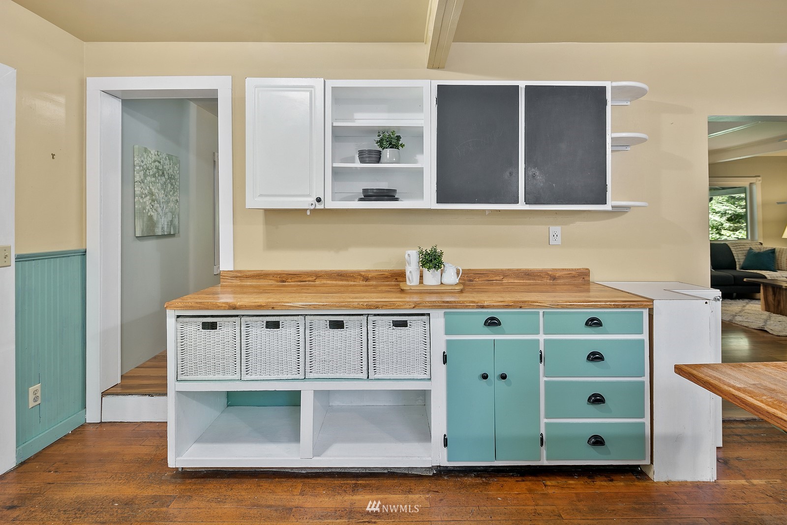 18416 Southeast Petrovitsky Road Renton, WA 98058 - Photo 9 of 36 a kitchen with cabinets and a wooden floor