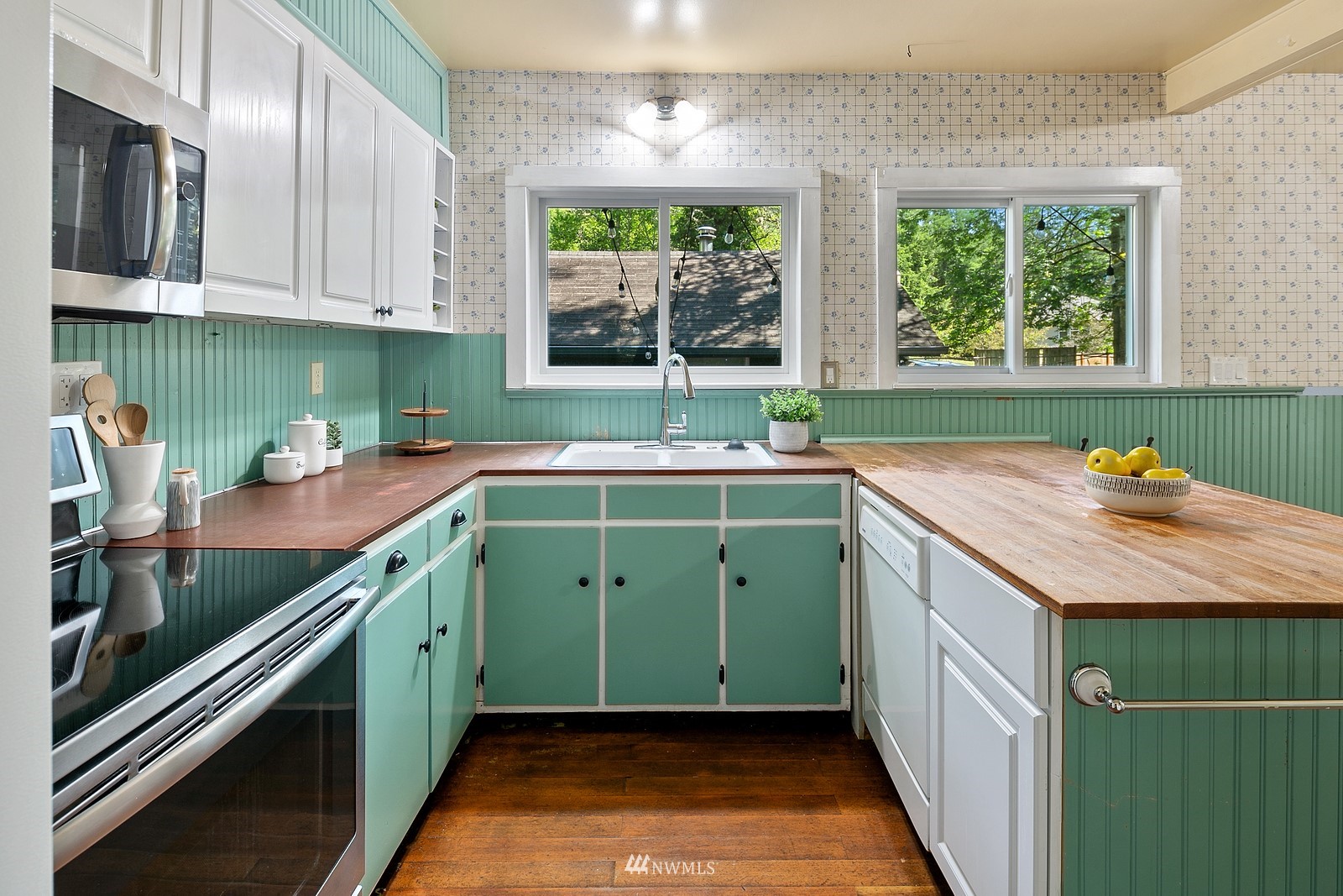 18416 Southeast Petrovitsky Road Renton, WA 98058 - Photo 10 of 36 a kitchen with a sink cabinets and window