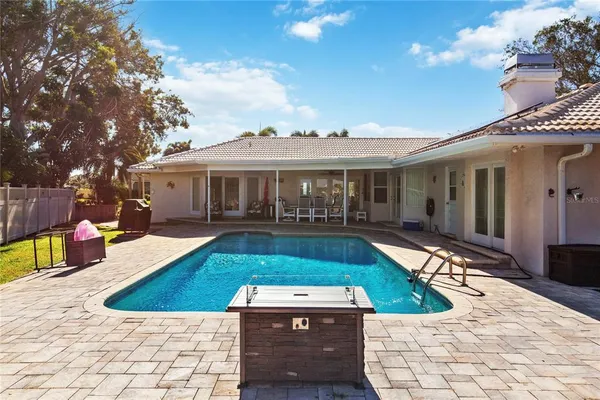 a front view of a house with a garden and yard
