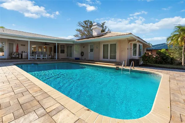 a kitchen with a refrigerator a sink and cabinets