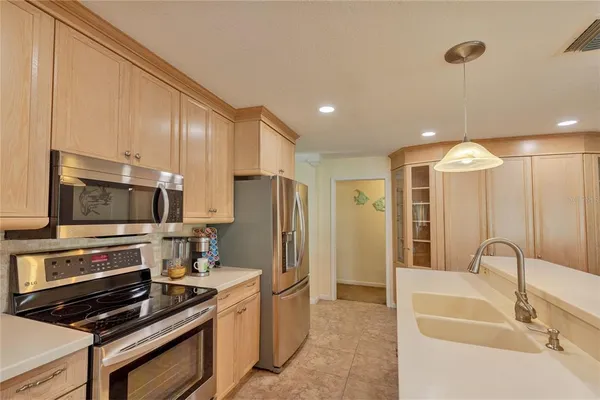 a bedroom with a bed and a view of kitchen