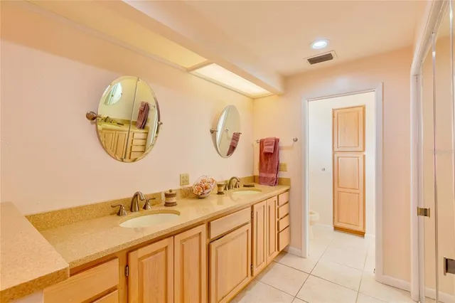 a bathroom with a toilet sink and shower