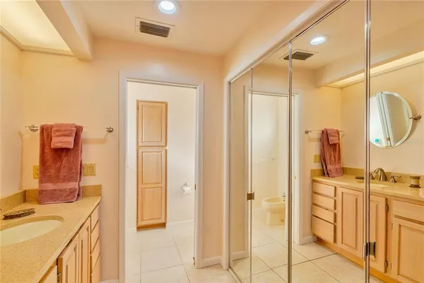 a bathroom with a shower and a glass door