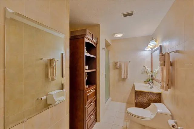 an aerial view of a city with lots of residential buildings lake and ocean view