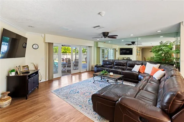 a view of a dining room with furniture and wooden floor