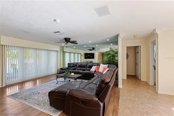 a view of a dining room with furniture and chandelier