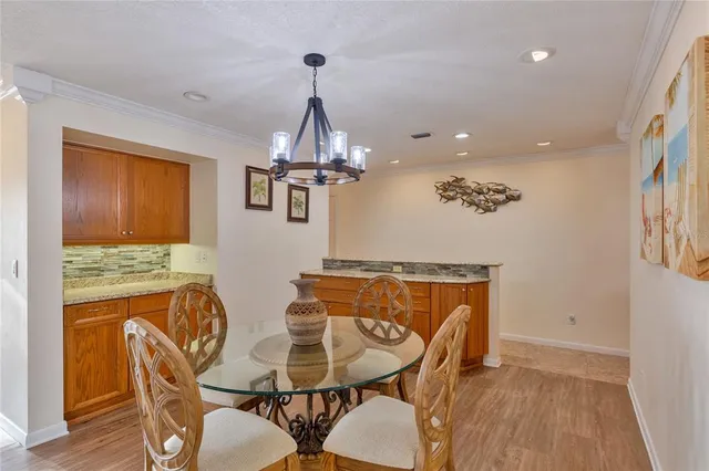 a bathroom with a granite countertop toilet a sink and a mirror