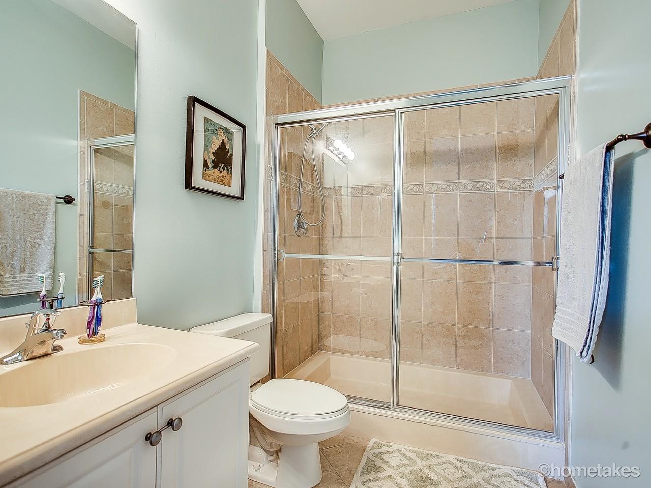 4308 Blowing Point Place Jupiter, FL 33458 - Photo 11 of 21 a bathroom with a sink toilet and shower