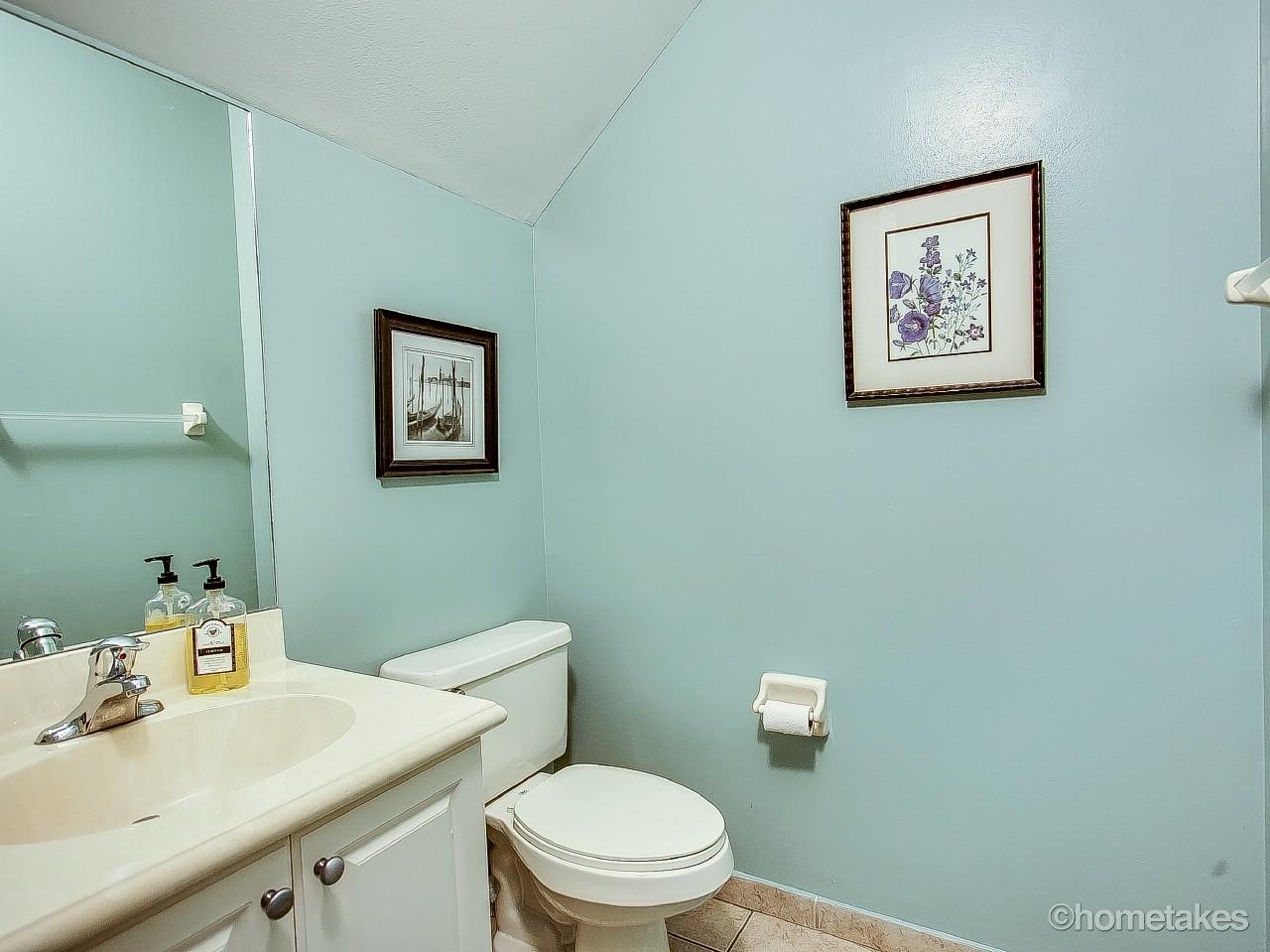 4308 Blowing Point Place Jupiter, FL 33458 - Photo 17 of 21 a bathroom with a toilet sink and mirror