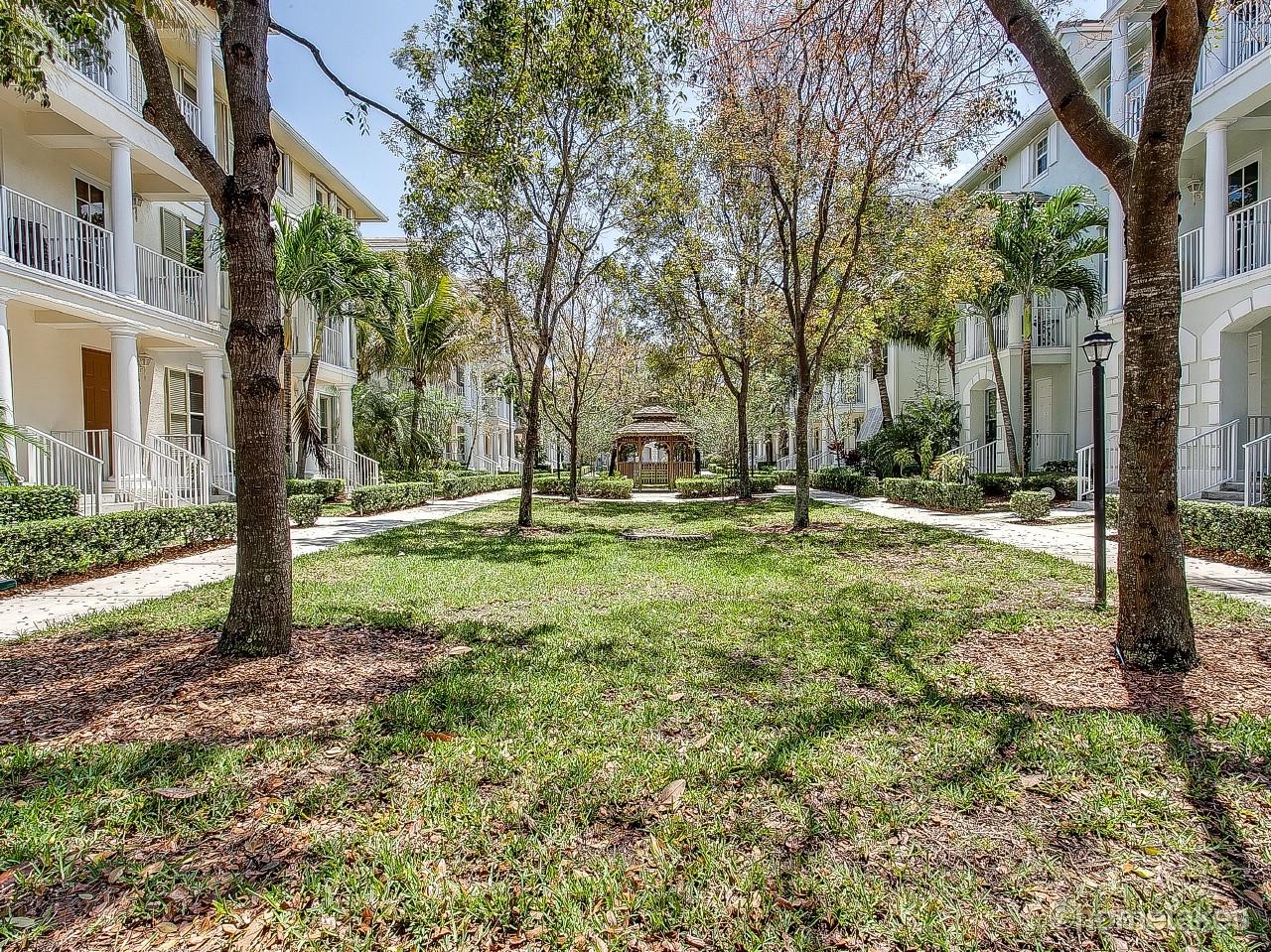 4308 Blowing Point Place Jupiter, FL 33458 - Photo 2 of 21 a backyard of a house with lots of green space