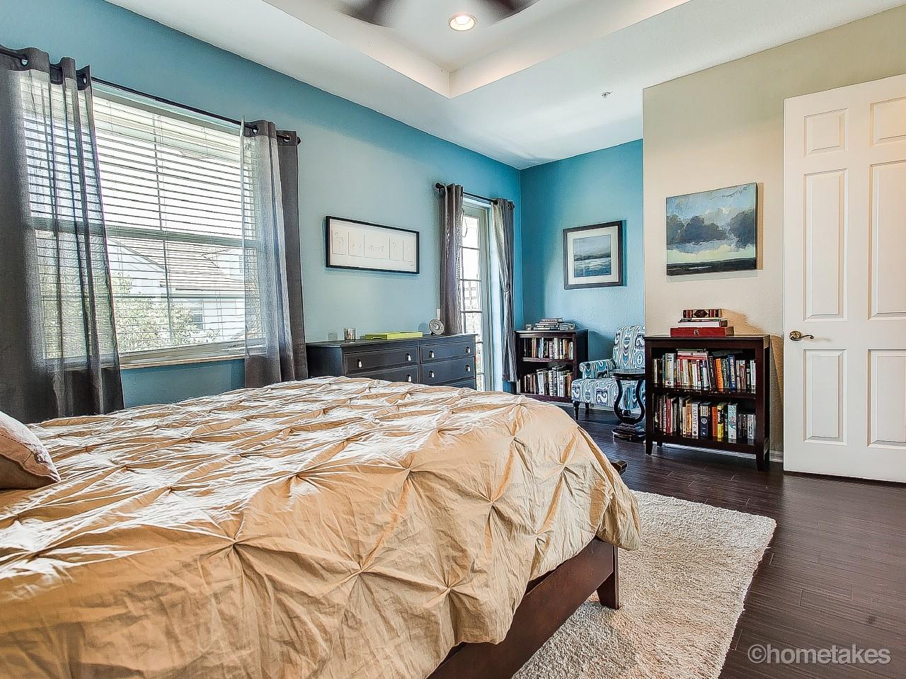 4308 Blowing Point Place Jupiter, FL 33458 - Photo 9 of 21 a bedroom with a bed and wooden floor