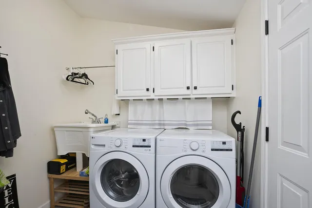 a view of storage and utility room with washer and dryer