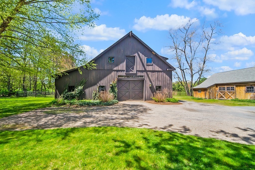 338 Neck Road Lancaster, MA 01523 - Photo 2 of 42 a front view of a house with garden