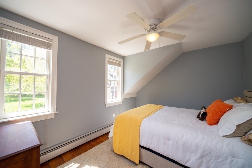 338 Neck Road Lancaster, MA 01523 - Photo 29 of 42 a bedroom with a bed and window