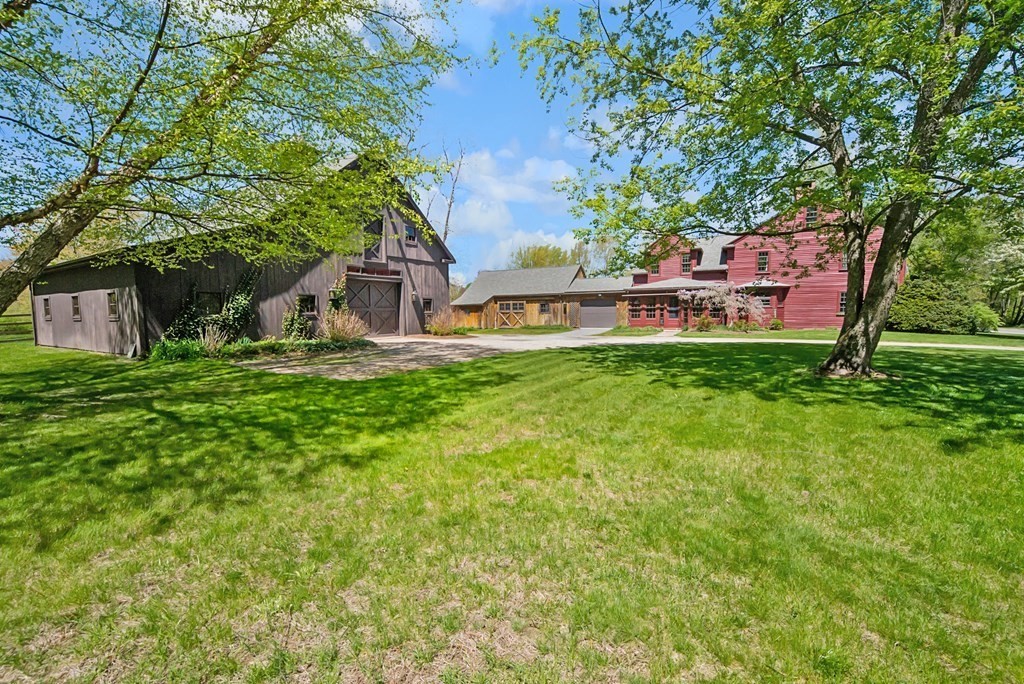 338 Neck Road Lancaster, MA 01523 - Photo 3 of 42 a view of a house with a yard porch and sitting area