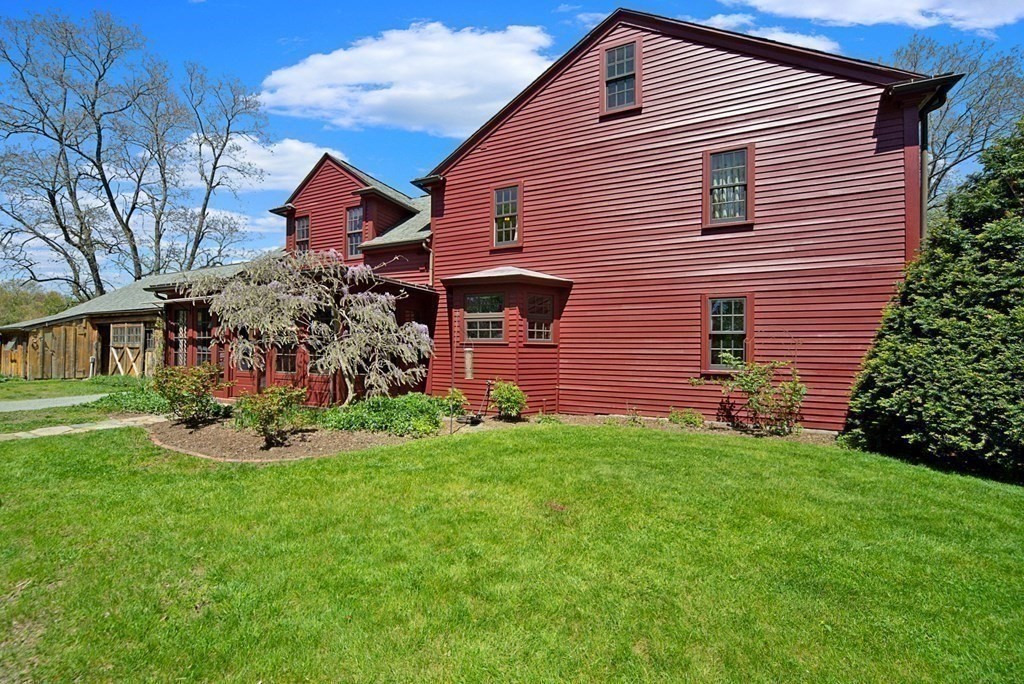 338 Neck Road Lancaster, MA 01523 - Photo 36 of 42 a front view of house with a garden