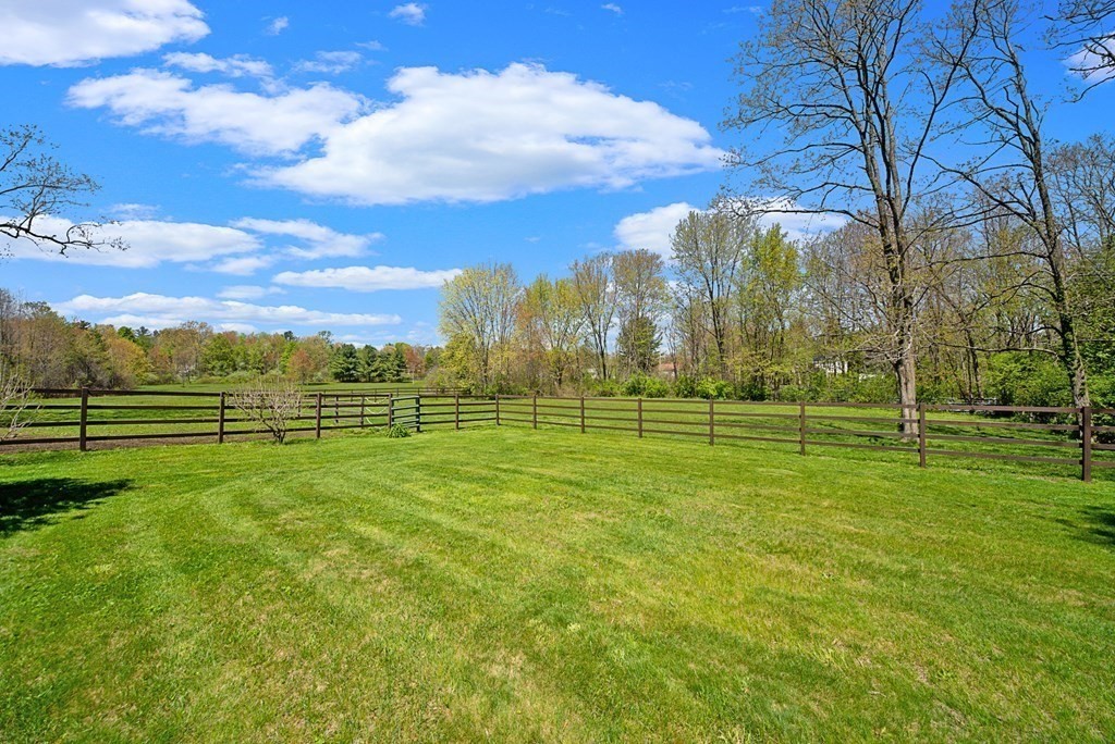 338 Neck Road Lancaster, MA 01523 - Photo 5 of 42 a view of a golf course with a lake