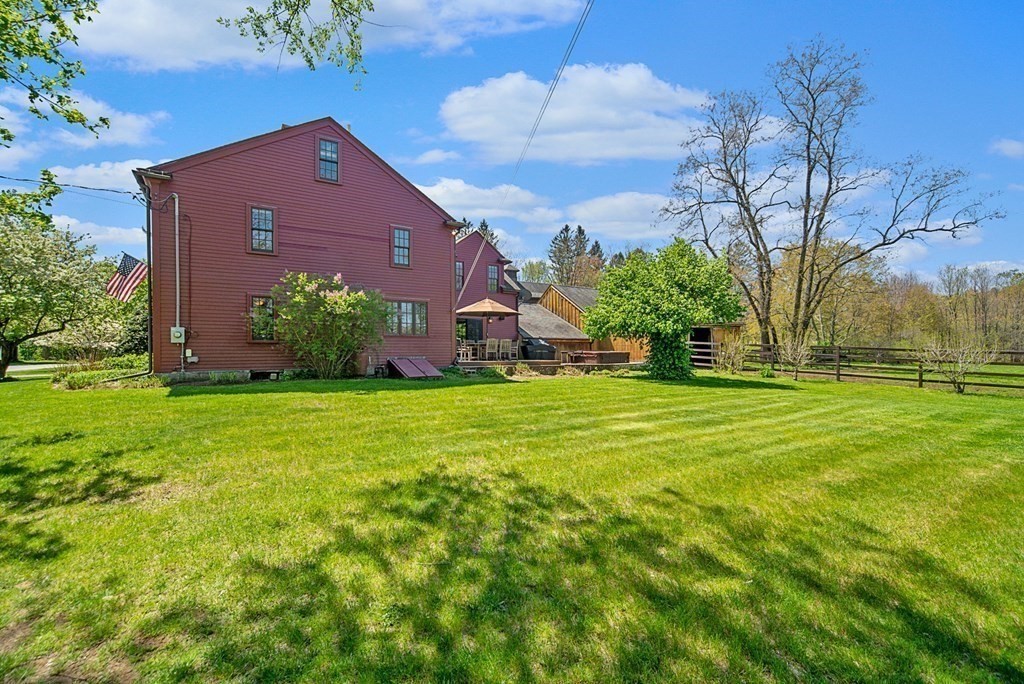 338 Neck Road Lancaster, MA 01523 - Photo 7 of 42 a front view of house with yard and green space