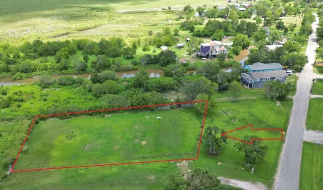 a view of a garden with a building