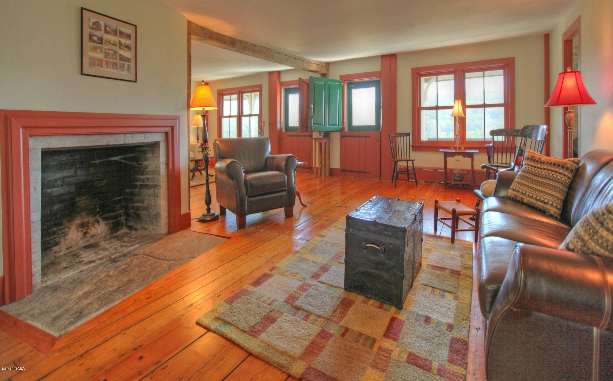 137 Jerusalem Road Tyringham, MA 01264 - Photo 20 of 59 a living room with furniture a fireplace and wooden floor