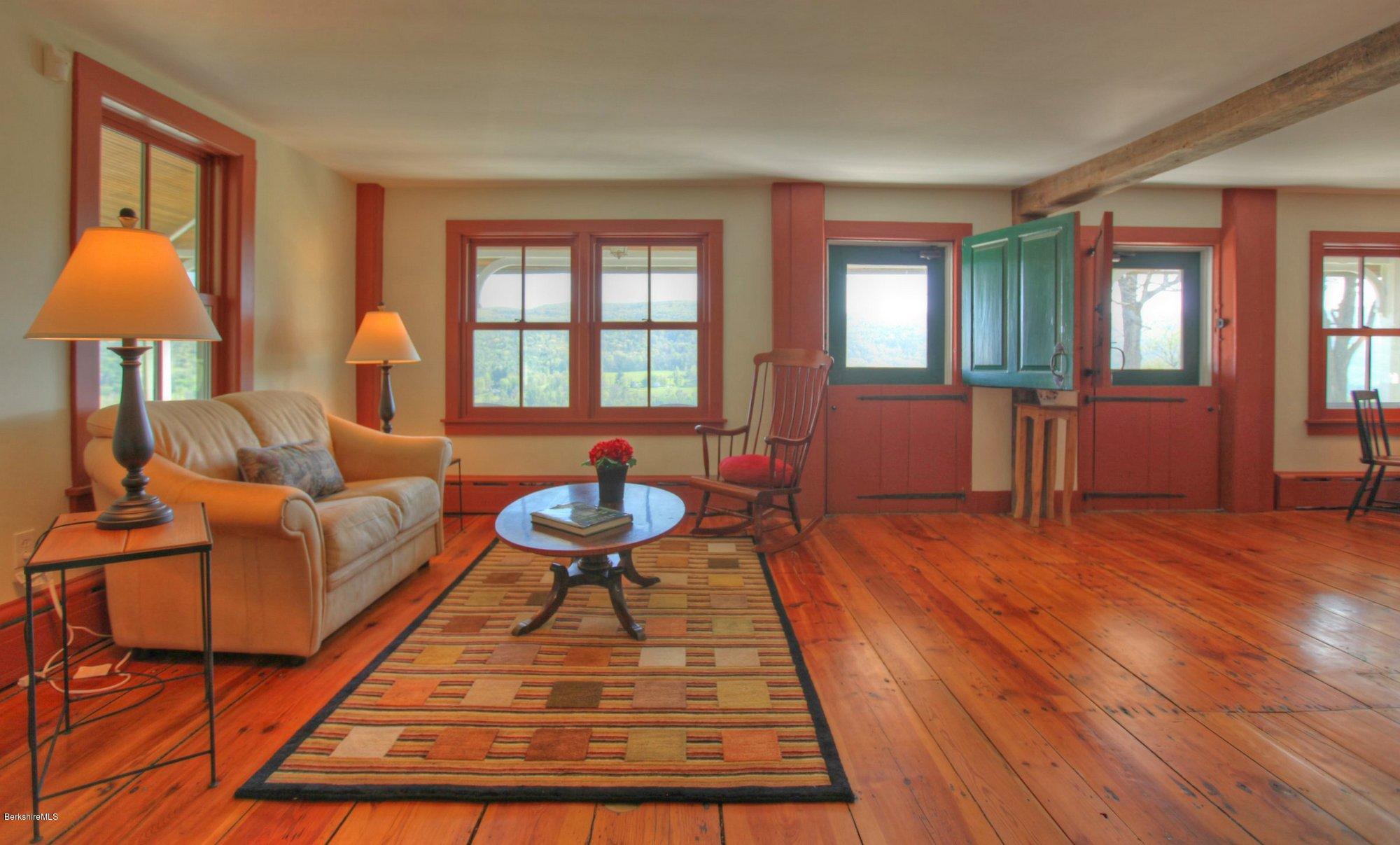 137 Jerusalem Road Tyringham, MA 01264 - Photo 22 of 59 a living room with furniture and a table