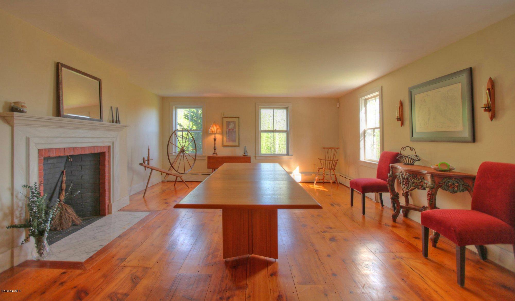 137 Jerusalem Road Tyringham, MA 01264 - Photo 23 of 59 a living room with furniture a fireplace and wooden floor