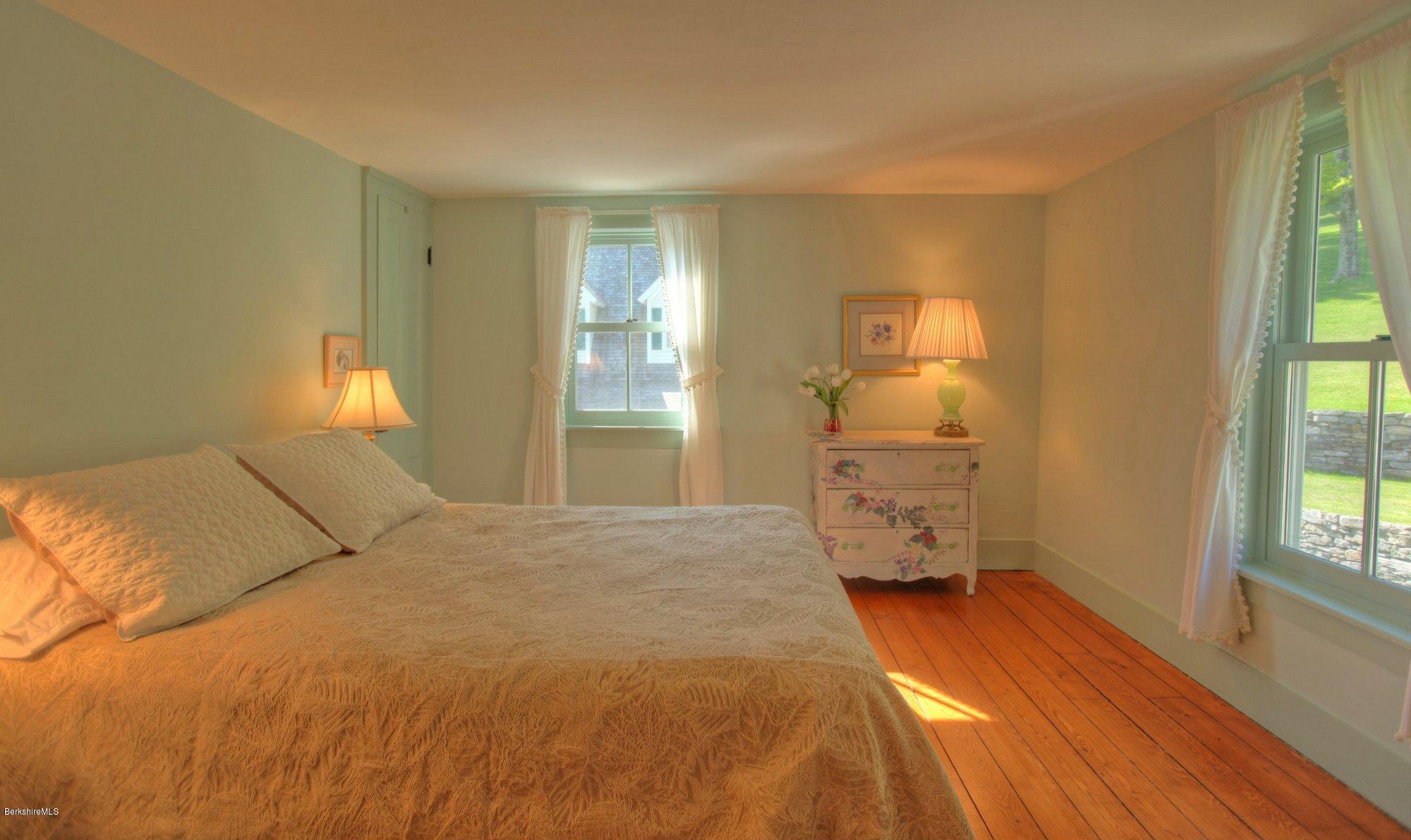 137 Jerusalem Road Tyringham, MA 01264 - Photo 31 of 59 a bedroom with a bed and a window