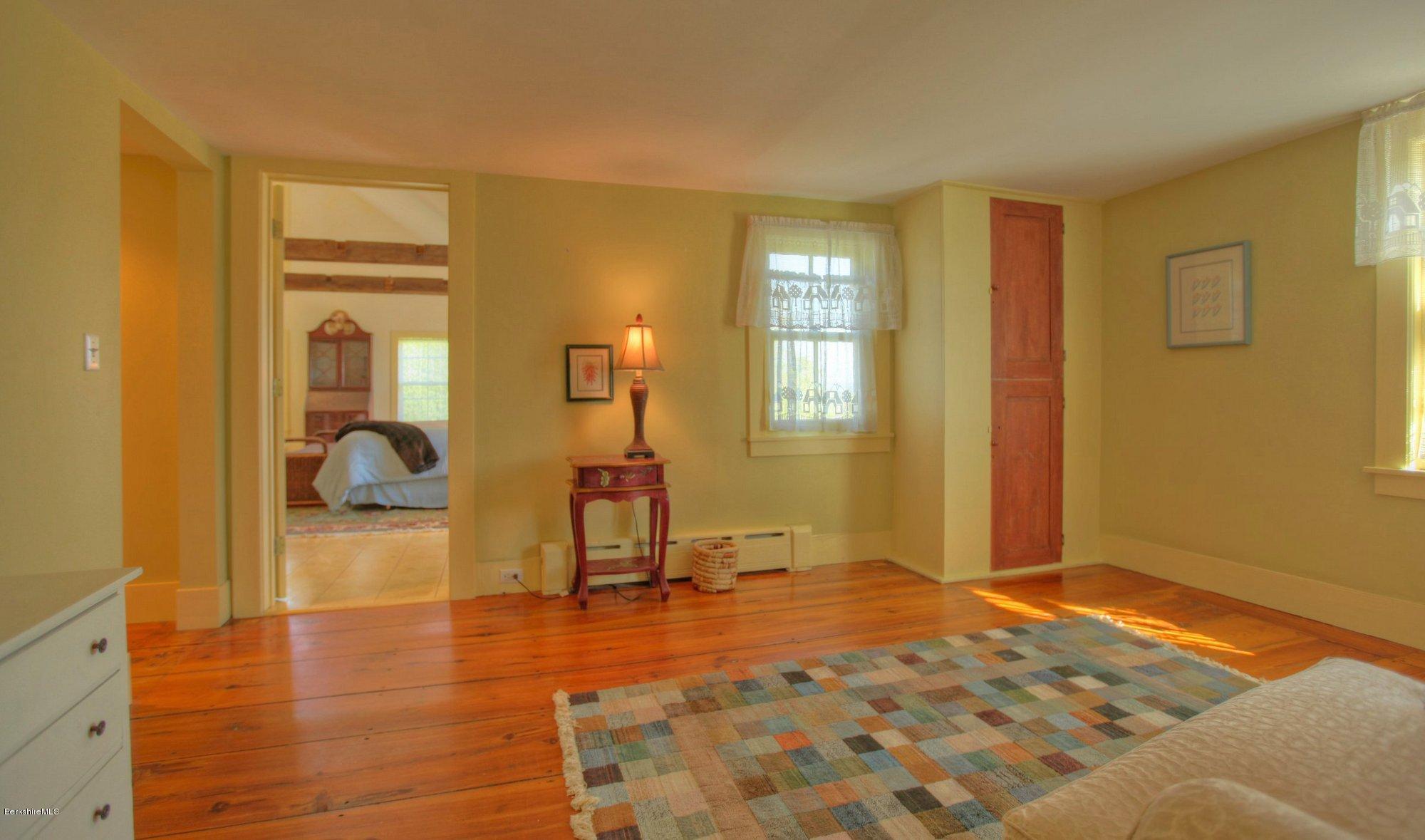 137 Jerusalem Road Tyringham, MA 01264 - Photo 34 of 59 a view of a livingroom with wooden floor and a bathroom