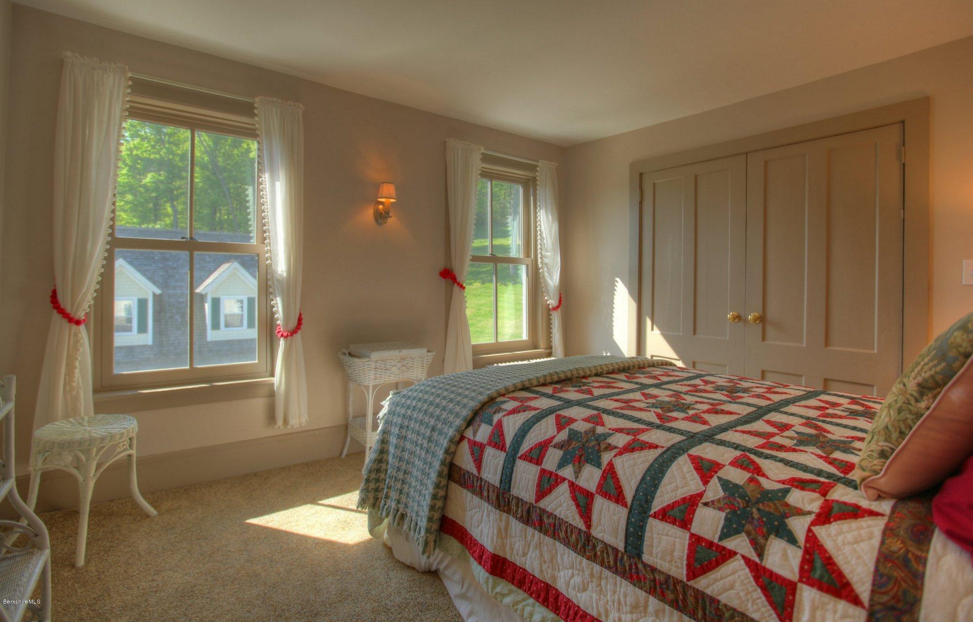 137 Jerusalem Road Tyringham, MA 01264 - Photo 40 of 59 a bedroom with a bed and windows