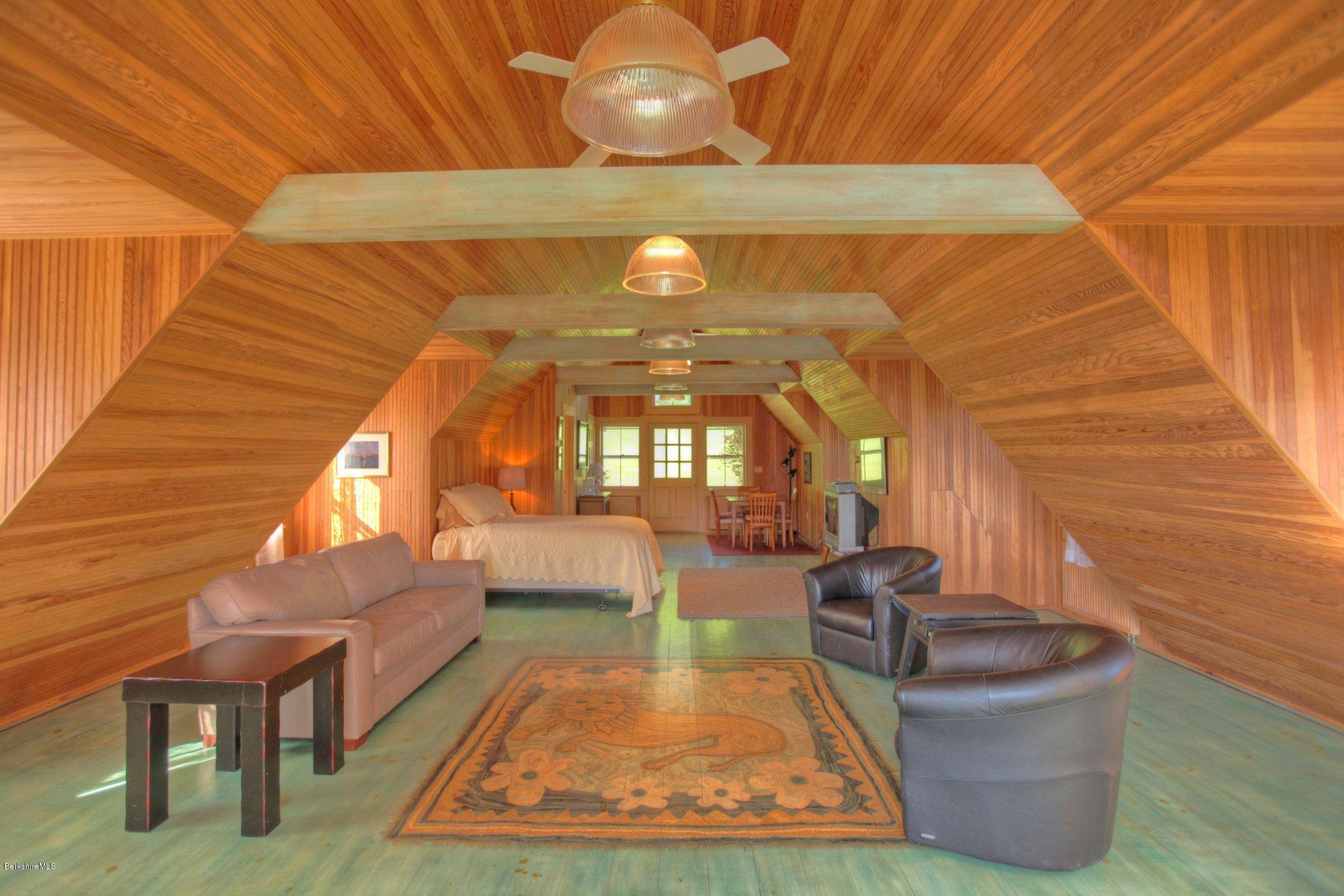 137 Jerusalem Road Tyringham, MA 01264 - Photo 41 of 59 a living room with furniture and a fireplace